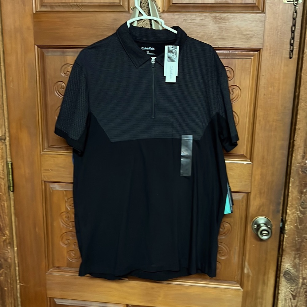 Calvin Klein 1/4 zip men’s shirt, new with tags. Size Large.